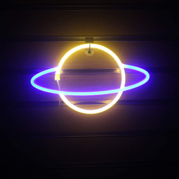 a neon sign hanging from the side of a building