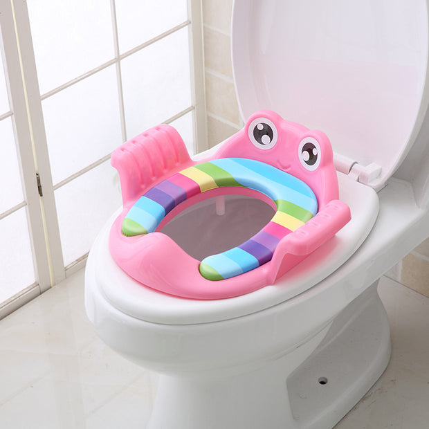 a child's potty seat in the shape of a frog